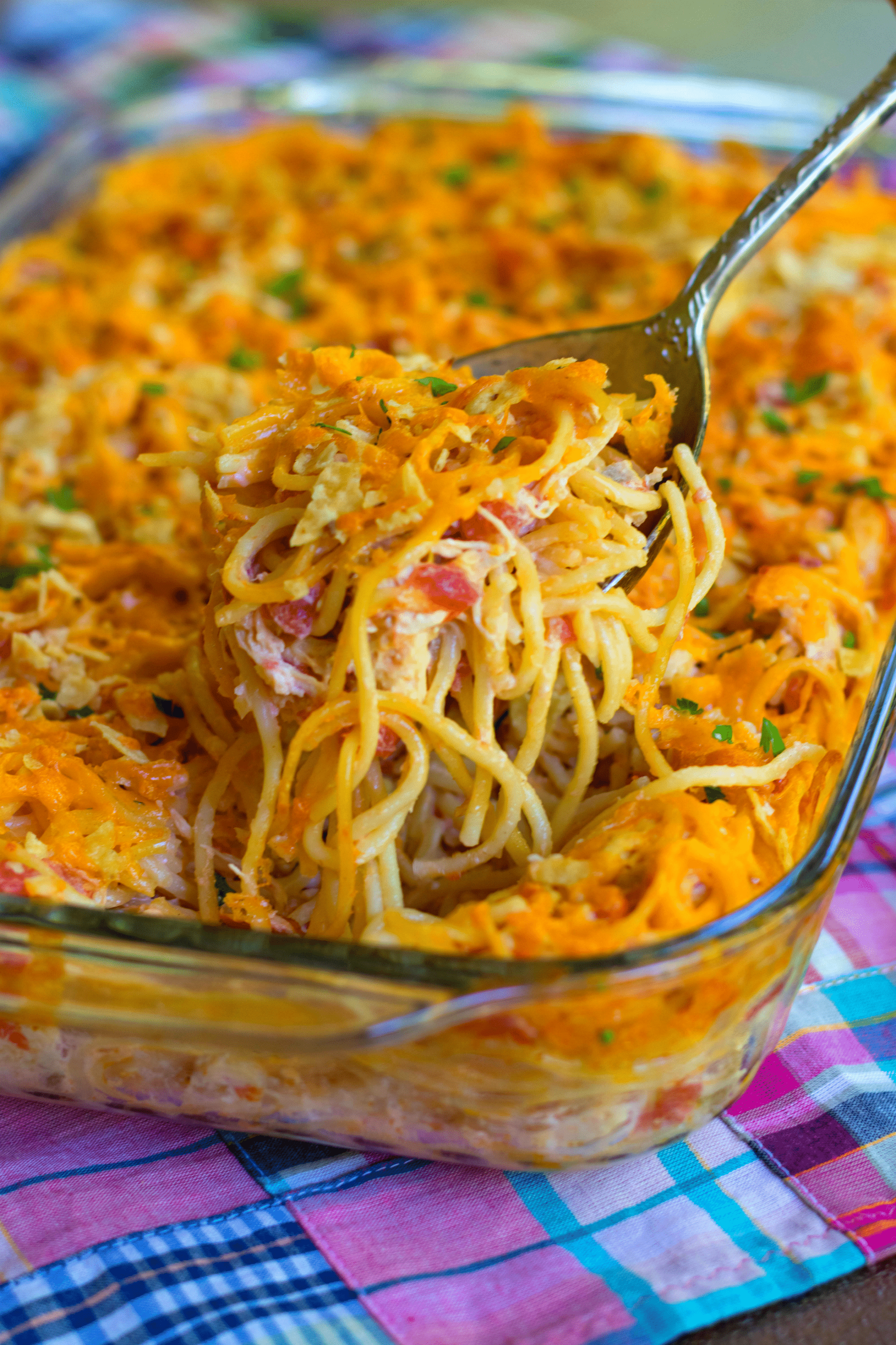 A delicious, easy to make casserole with spaghetti, chicken, Rotel tomatoes and chilie, cream cheese, sour cream and cheddar cheese. A great dish for potlucks, covered dish suppers or when you're feeding a crowd!