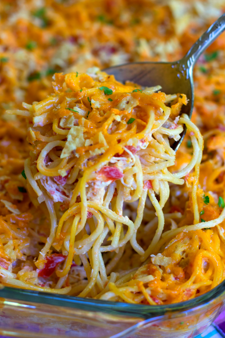 A delicious, easy to make casserole with spaghetti, chicken, Rotel tomatoes and chilie, cream cheese, sour cream and cheddar cheese. A great dish for potlucks, covered dish suppers or when you're feeding a crowd!
