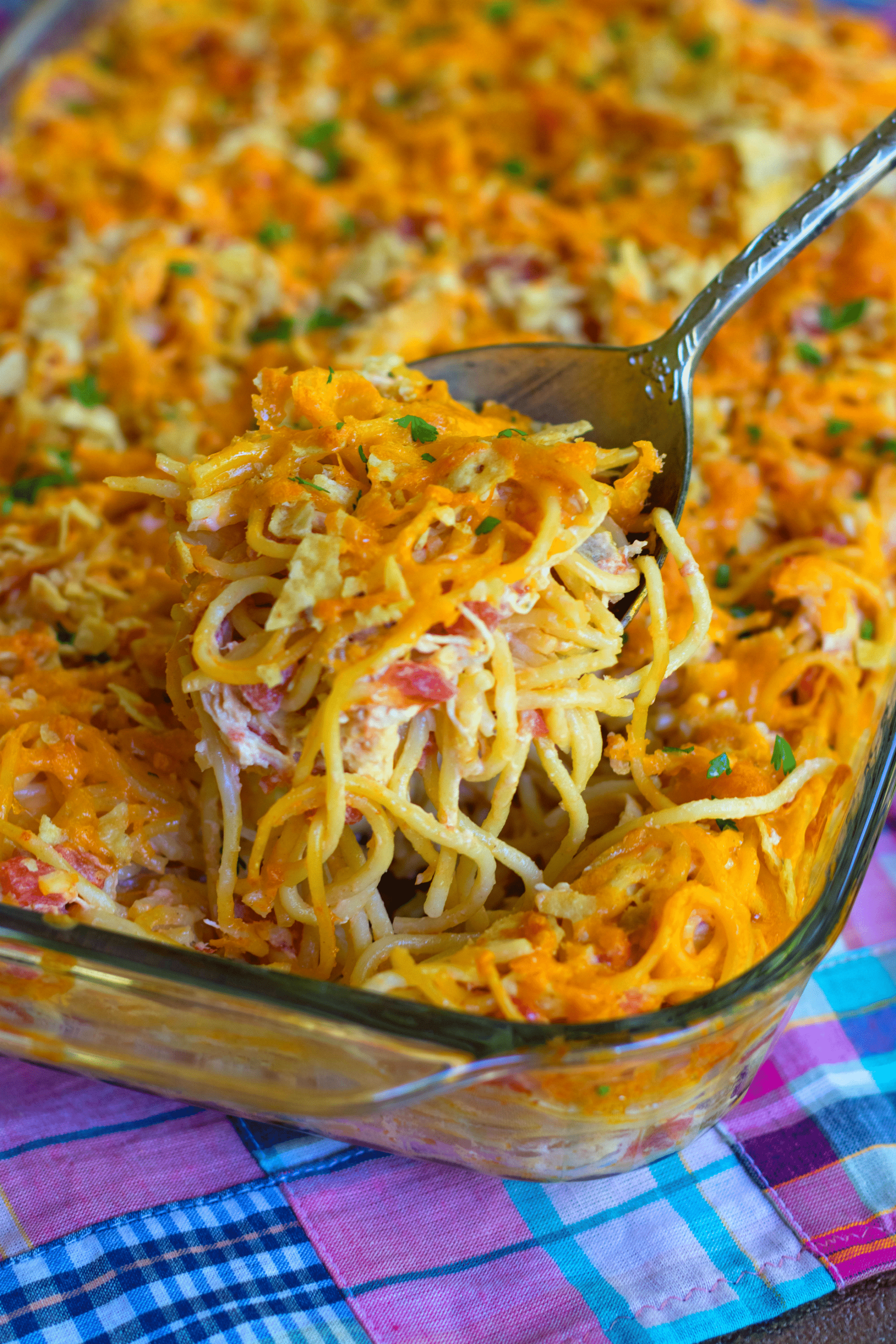 A delicious, easy to make casserole with spaghetti, chicken, Rotel tomatoes and chilie, cream cheese, sour cream and cheddar cheese. A great dish for potlucks, covered dish suppers or when you're feeding a crowd!