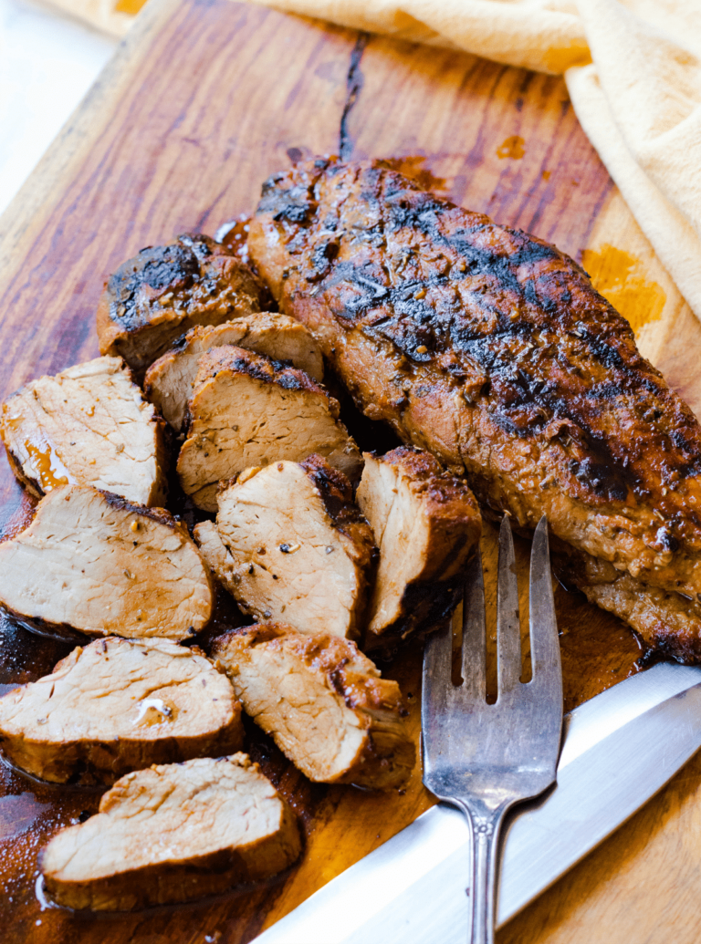 Grilled Pork Tenderloin marinated in olive oil, balsamic vinegar, dried italian seasoning and garlic is tender and juicy. This easy to make recipe is great for a weeknight meal or when you're having guests.