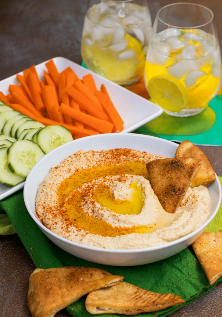 Roasted Garlic Hummus is so delicious and easy to make. Made with olive oil, roasted garlic cloves, chickpeas, lemon juice, tahini, salt and red pepper flakes that are blended together until silky smooth.