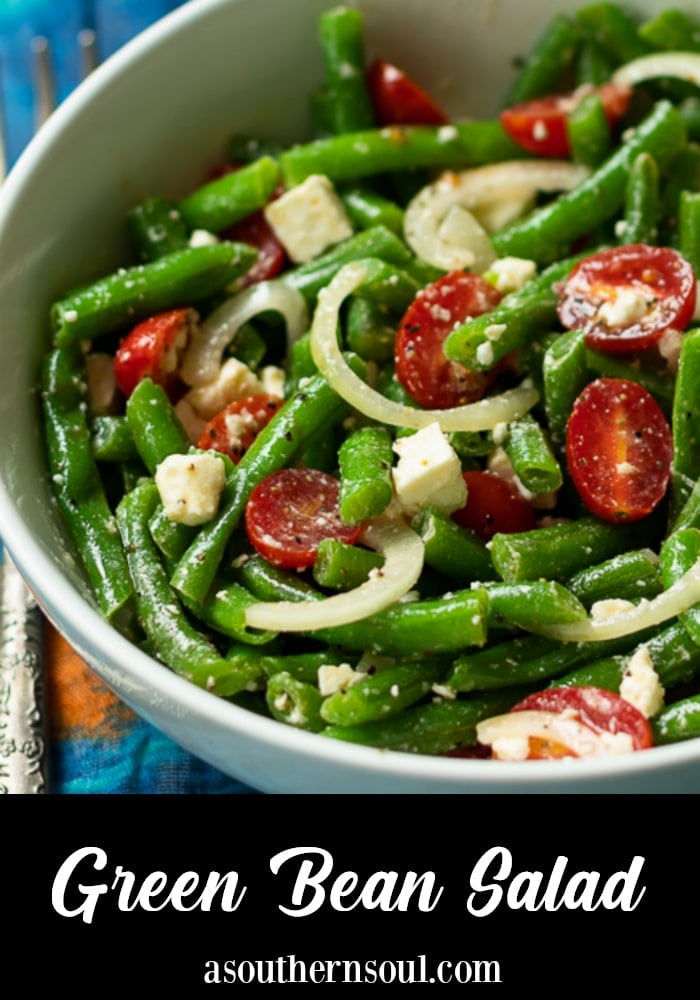Green Bean Salad made with fresh bean, tomatoes, onions and feta cheese, tossed into a light lemony dressing is the perfect side dish for any meal!
