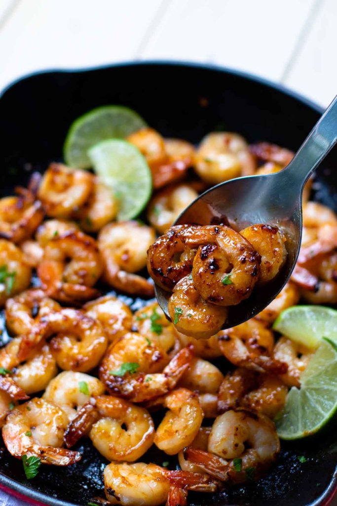 Garlic Honey Lime Shrimp are easy to make in just 15 minutes! Made with peeled, deveined shrimp, olive oil, red pepper flakes, salt, pepper, honey, and fresh lime juice. Perfect for an appetizer or a main dish.