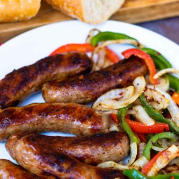 This classic combination of Grilled Sausage, Peppers and Onions is totally easy to make and delicious. Made with mild Italian sausage, sliced red and green bell pepper and yellow onions seasoned with salt and pepper and cooked on the grill.