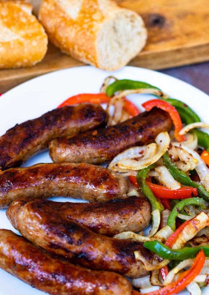This classic combination of Grilled Sausage, Peppers and Onions is totally easy to make and delicious. Made with mild Italian sausage, sliced red and green bell pepper and yellow onions seasoned with salt and pepper and cooked on the grill.