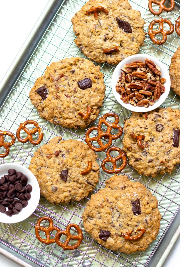 Kitchen Sink Cookies are loaded with sweet, savory and salty goodness! Made with butter, sugar, flour, oats, dark chocolate, chocolate chips, coconut, pecans and pretzels. This is one cookie that that has something for everyone!