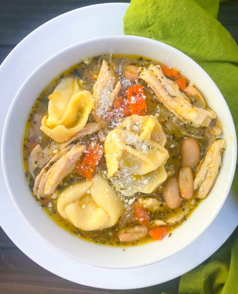 Homemade Chicken and Cheese Tortellini Soup is hearty and so easy to make. Made with rotesseri chicken, cheese filled tortellini, white beans, carrots, celery and herbs in a store bought broth.