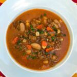 Crock pot beef and bean soup in tomato broth.