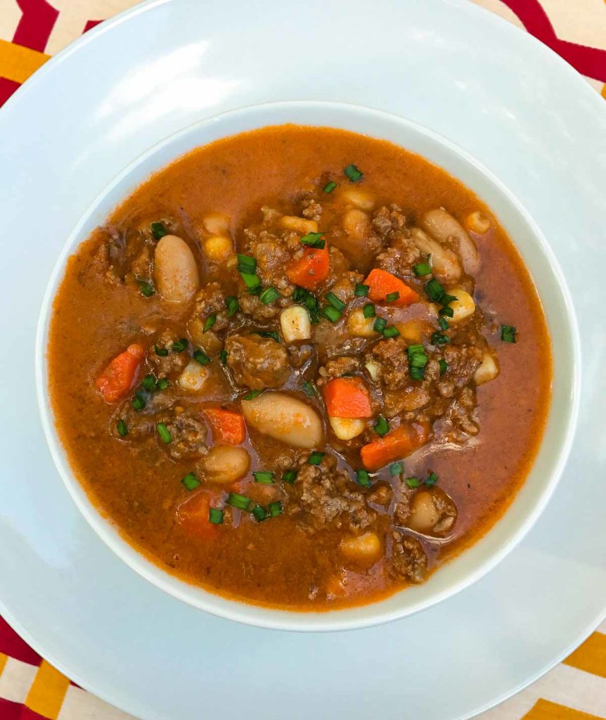 Crock pot beef and bean soup in tomato broth.
