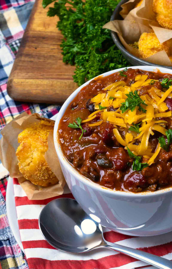 Award Winning Southern Soul Chili with cheese, parsley and corn bread muffins.