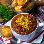 Bowl of Award Winning Southern Soul Chili with corn bread muffins.