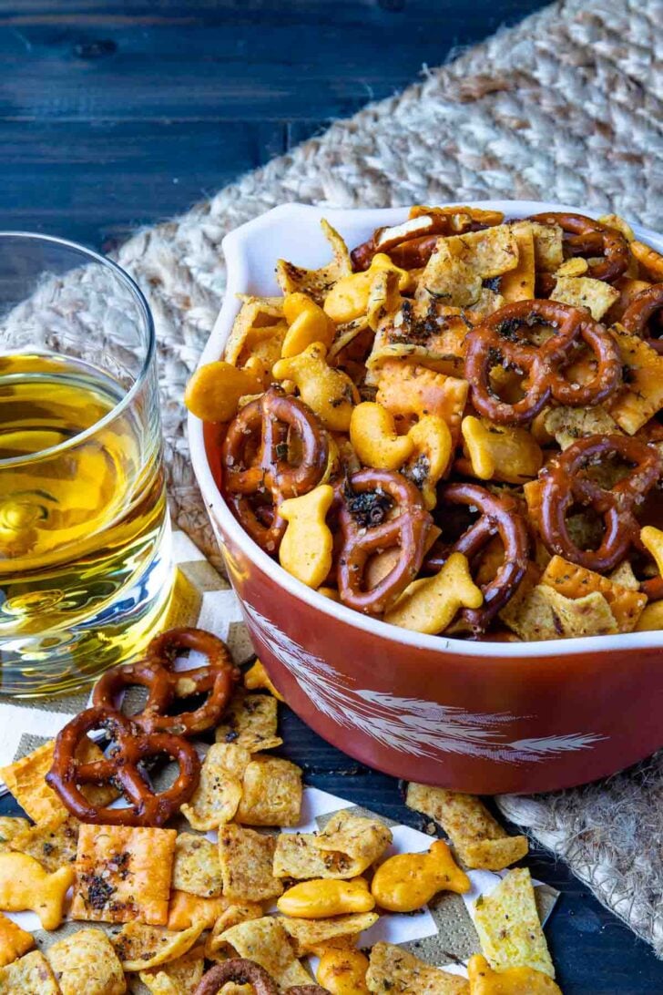 Spicy Cheese Crackers with pretzels and Fritos with a drink for snack time.