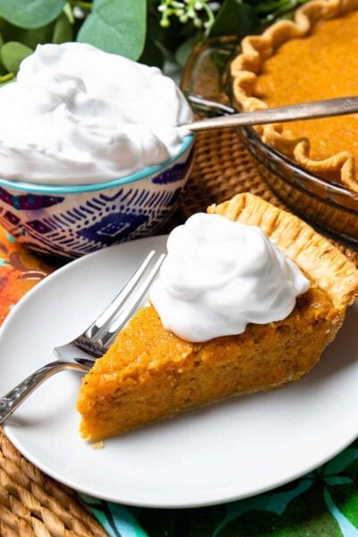 Classic Sweet Potato Pie with fresh whipped cream is an easy to make desssert.