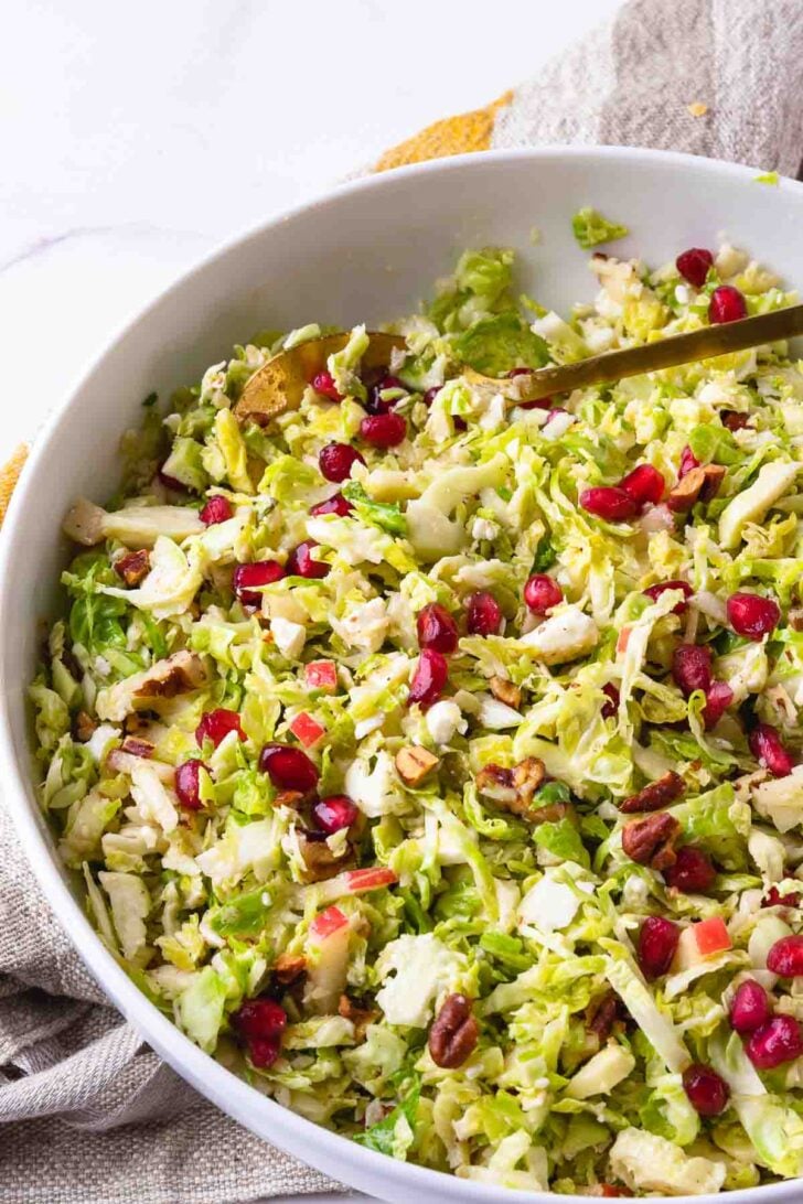 Brussels Sprouts Slaw in a bowl to serve as a side dish any time of the year.