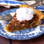 Sliced Maple Bourbon Pecan Pie on cooling rack and on plate.