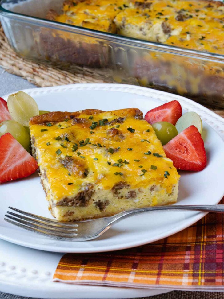 Sausage and Egg Breakfast Bake served with fresh fruit for breakfast.