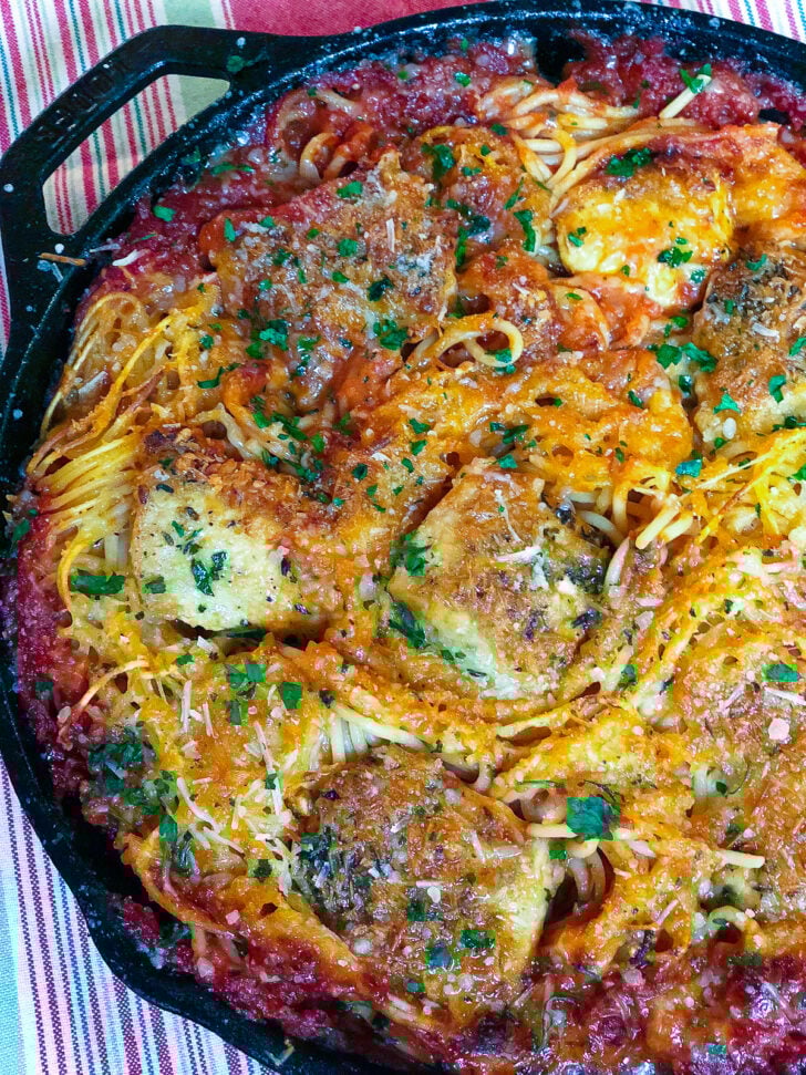 On pan Skillet Chicken Spaghetti on a striped towel to cool.