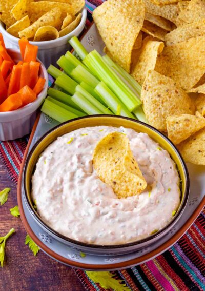 Southwest Ranch Dip served in a bowl with veggies and tortilla chips.