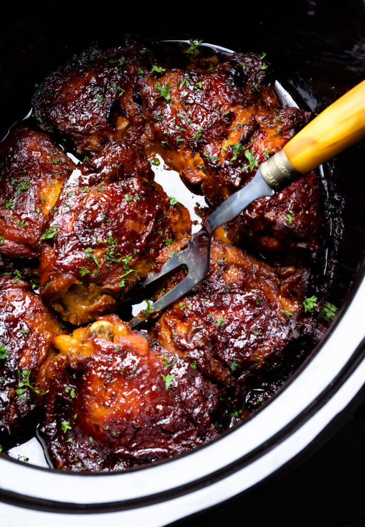 Crock Pot Chicken thighs slow cooked in a home sauce is the perfect recipe served at any occasion.