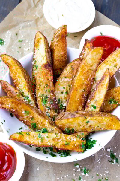 Bowl of potato wedges cooked in the air fryer.