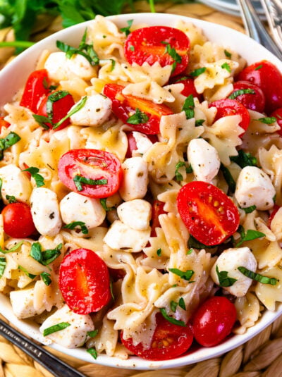 Ripe tomatoes and mozzarella pearls make the Best Caprese Pasta Salad.
