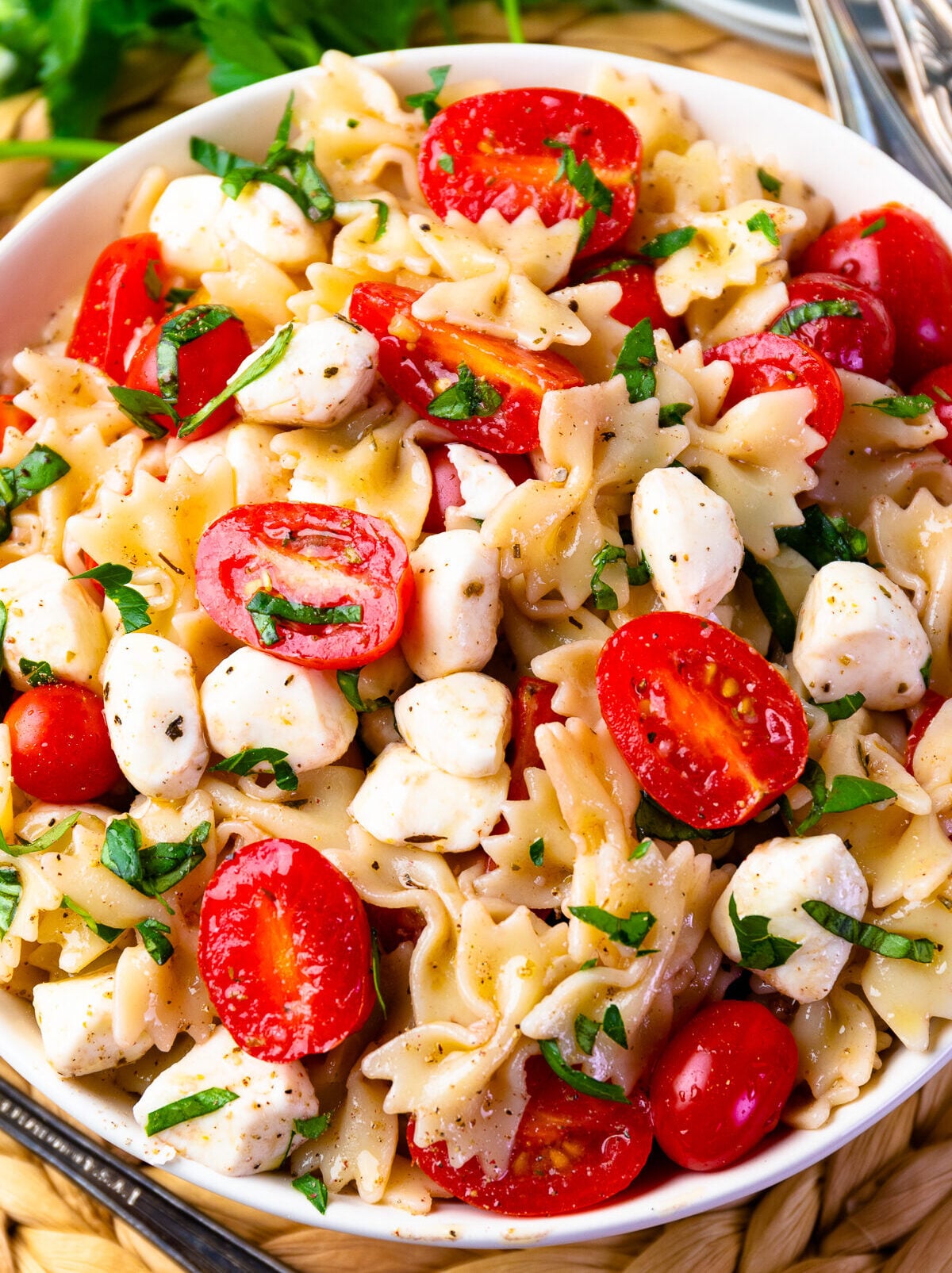 Ripe tomatoes and mozzarella pearls make the Best Caprese Pasta Salad.