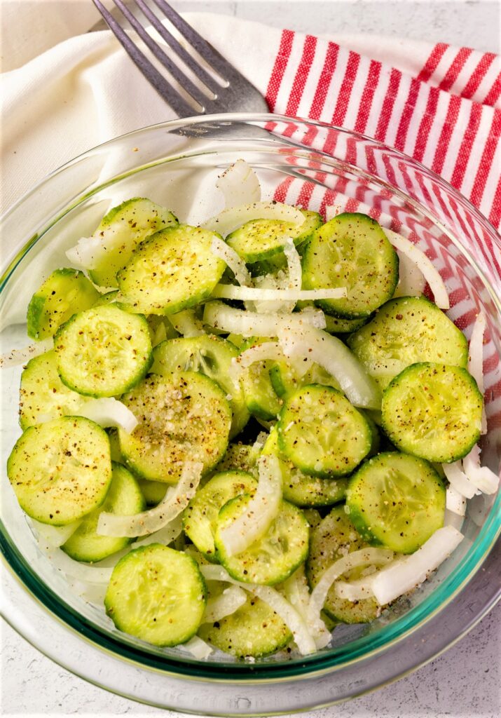 Bowl of cucumbers and onions for easy to make refrigerator pickles.