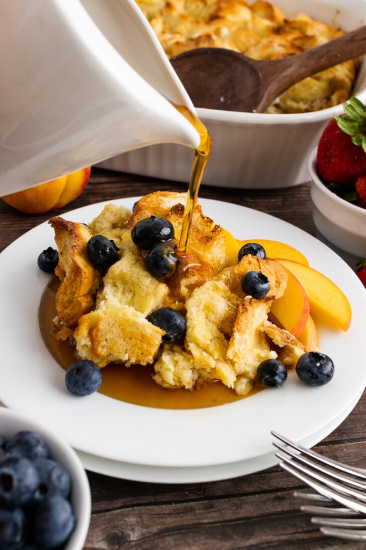 French Toast Bread Pudding with syrup pour.