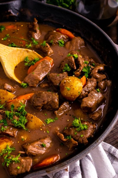 Skillet Beef Stew in a pan with wooden spoon