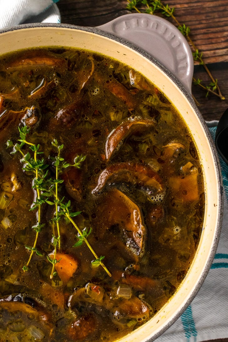 Homemde mushroom soup in a gray stock pot.