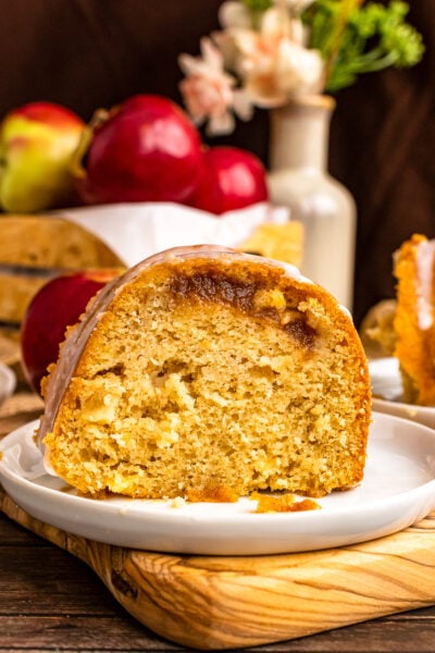 Slice of Apple Spice Cake on a white plate.