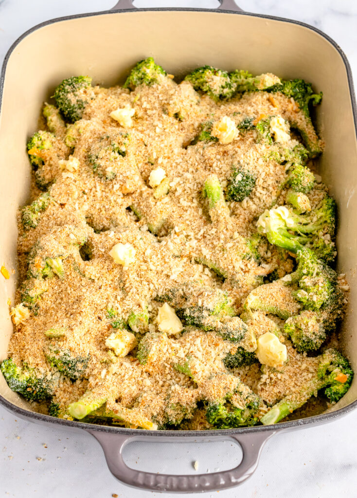Broccoli Casserole in a baking pan topped with breadcrumbs.