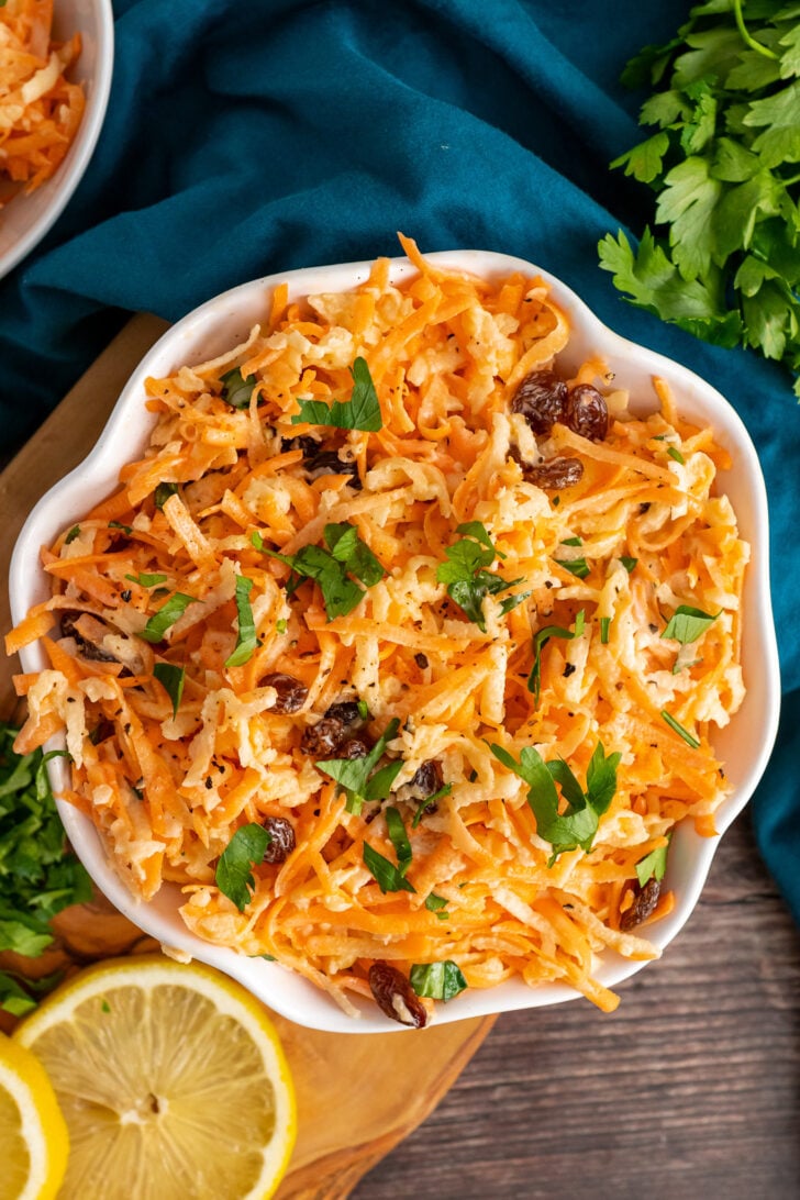 Carrot Apple Salad with raisins and fresh parsley.
