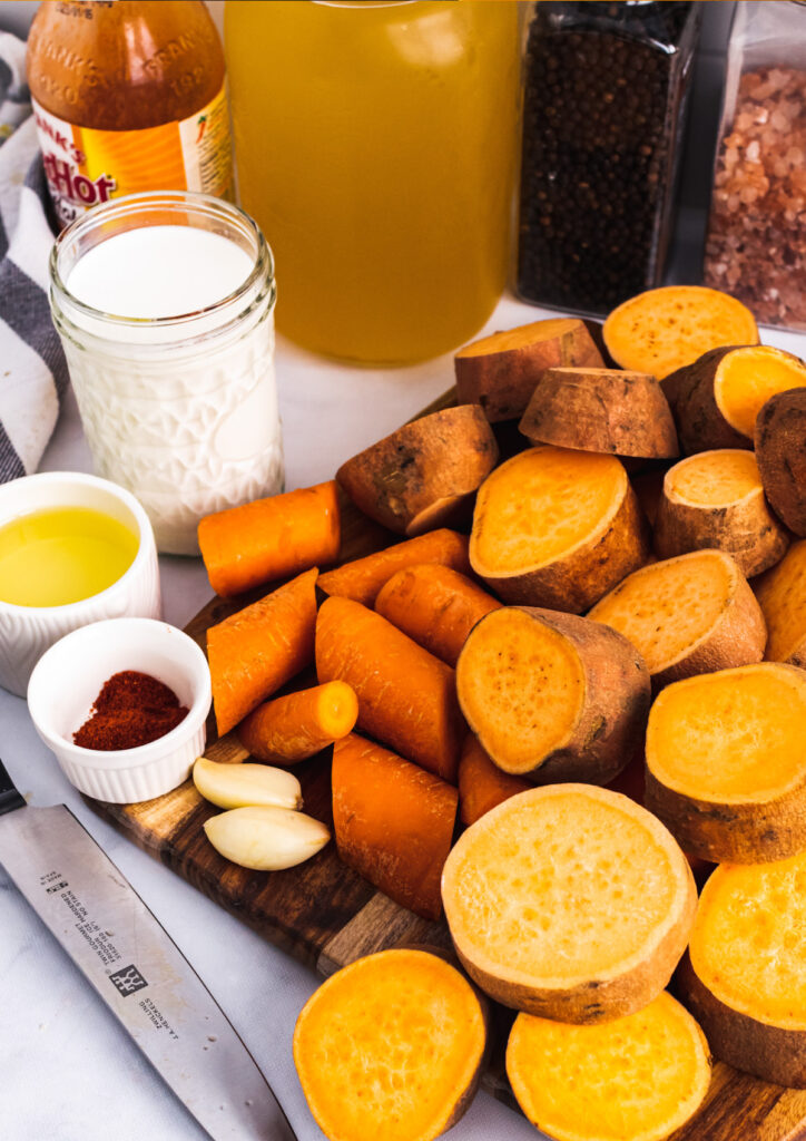 Sweet potatoes, carrots, cream, stock and seasoning for sweet potato soup.