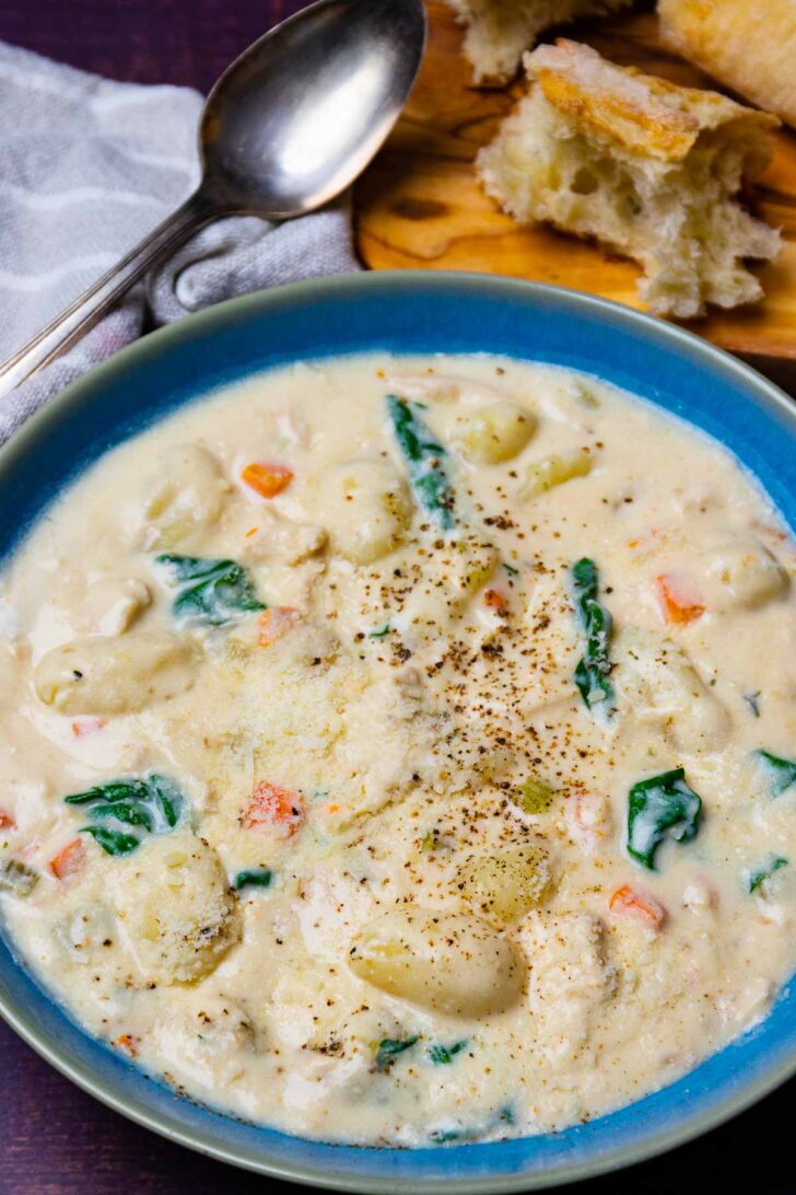 Creamy Gnocchi Chicken Soup in a blue bowl.