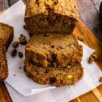 Sliced baked Zucchini Bread on a cutting board.
