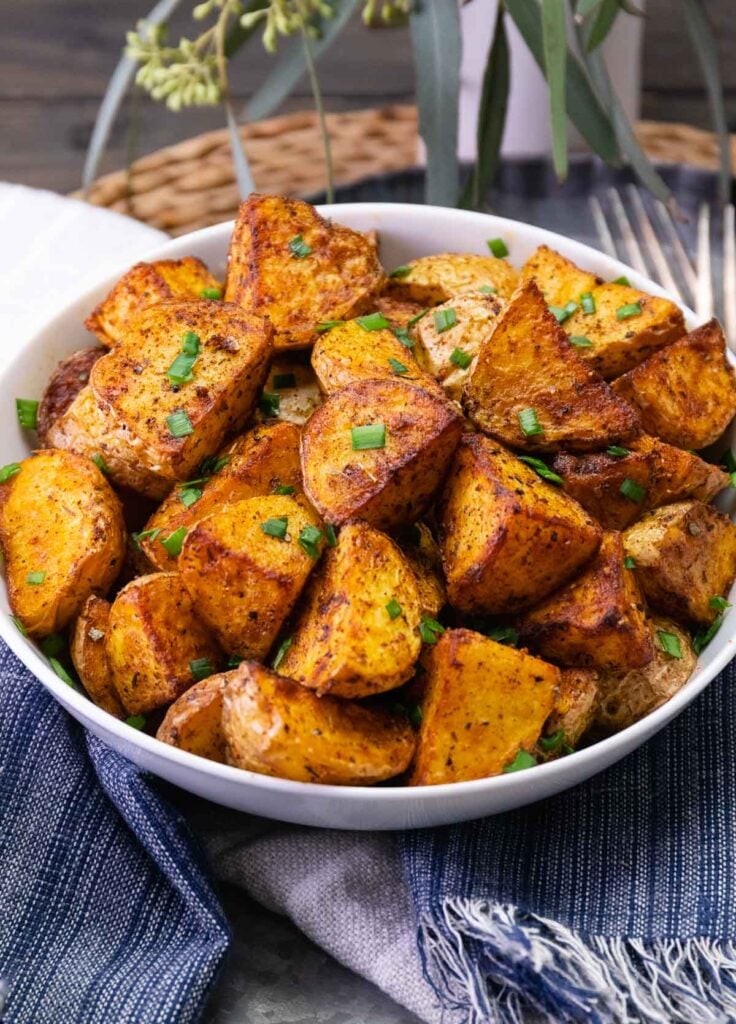 Cajun potatoes made in the air fryer sprinkled with chives.