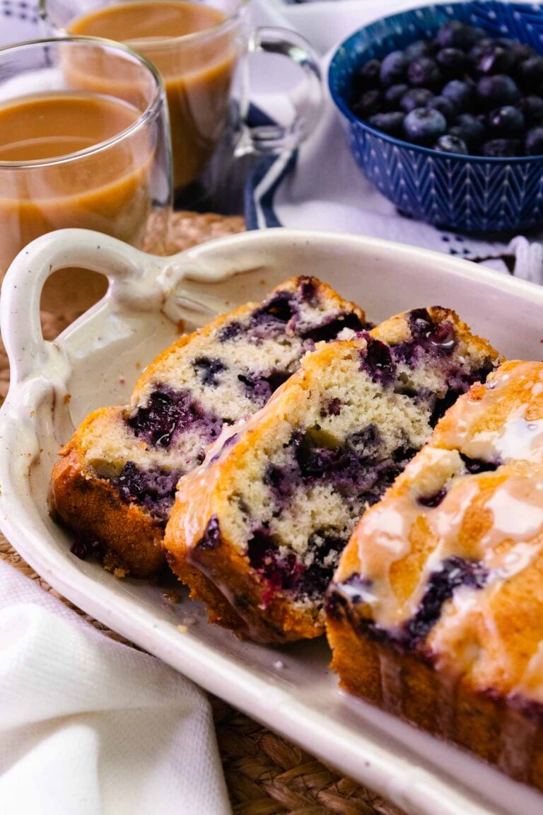 Homemade Blueberry Bread sliced served with coffee.