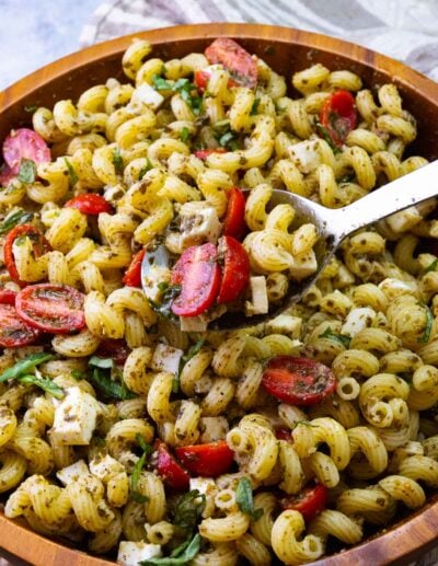 Pesto Pasta Salad with tomatoes and mozzarella cheese is easy to make and delicious.