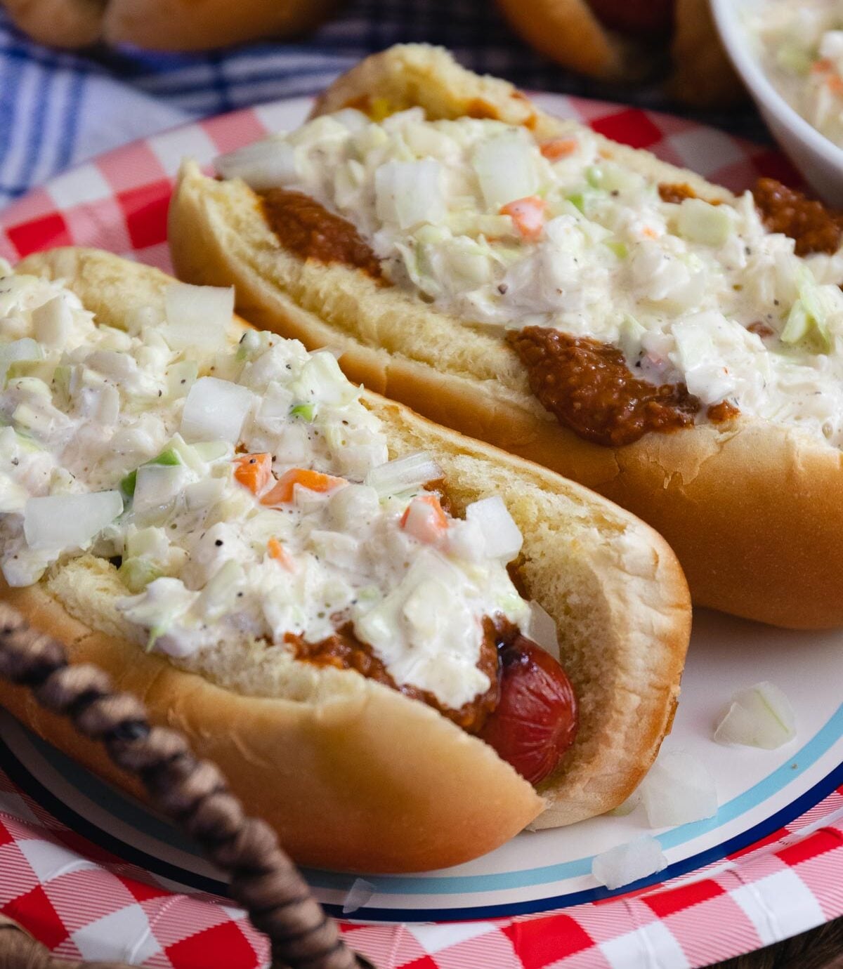 Carolina Slaw Dogs are loaded with flavor! Made with hot dogs in buns, mustard, chili, onions and creamy coleslaw.