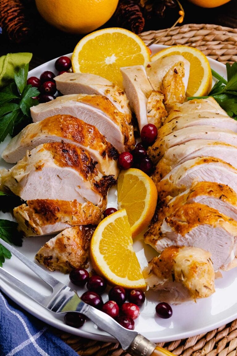 Juicy, tender turkey breast cooked in the crock pot, sliced and ready to serve for Thanksgiving.