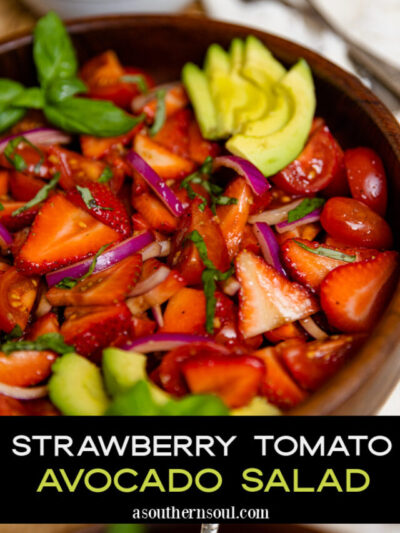 Wooden bowl with strawberry tomato avocado salad served with a silver spoon as a delicious side dish shown with 2 images for Pinterest.