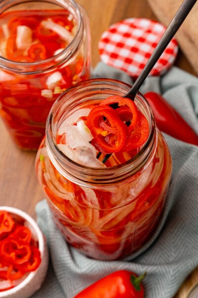 Quick Pickled Sweet Red Pepper And Onions are easy to make without the trouble of traditional canning and are great on burgers, hot dogs, sandwiches and tacos!