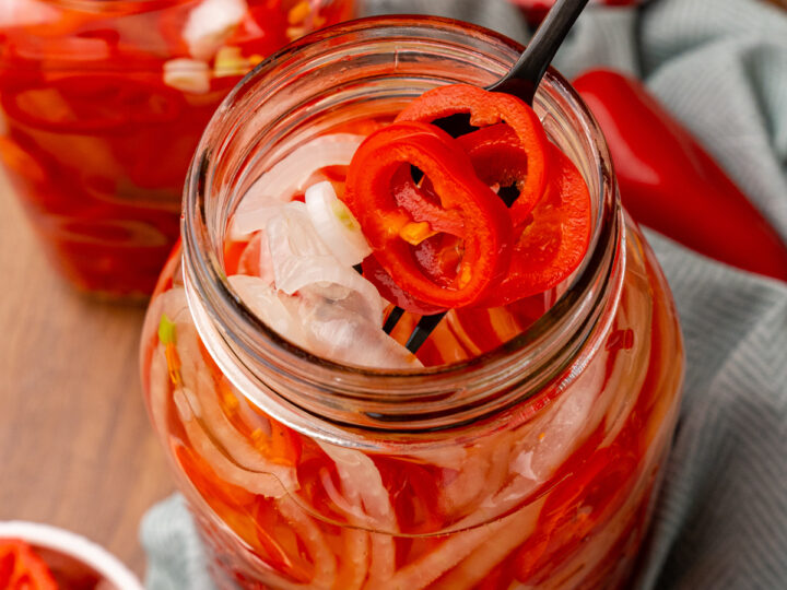 Quick Pickled Sweet Red Pepper And Onions are easy to make without the trouble of traditional canning and are great on burgers, hot dogs, sandwiches and tacos!