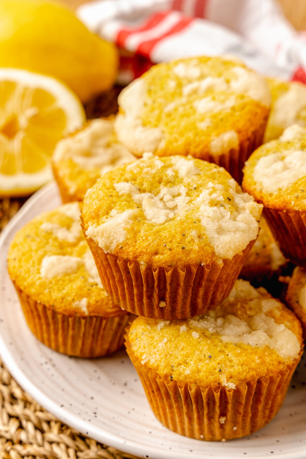 Lemon Poppy Seed Muffins with a sweet topping baked in cupcake papers are the perfect easy to make treat for breakfast, brunch or a grab and go treat.