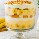 Banana pudding in a large bowl. Layered perfectly with bananas cream whipped topping and vanilla wafers.