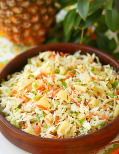 Pineapple Slaw is made with pineapple chunks, bagged cabbage, sliced almonds and green onions with a light, sweet dressing is a side dish that is great for any occasion!