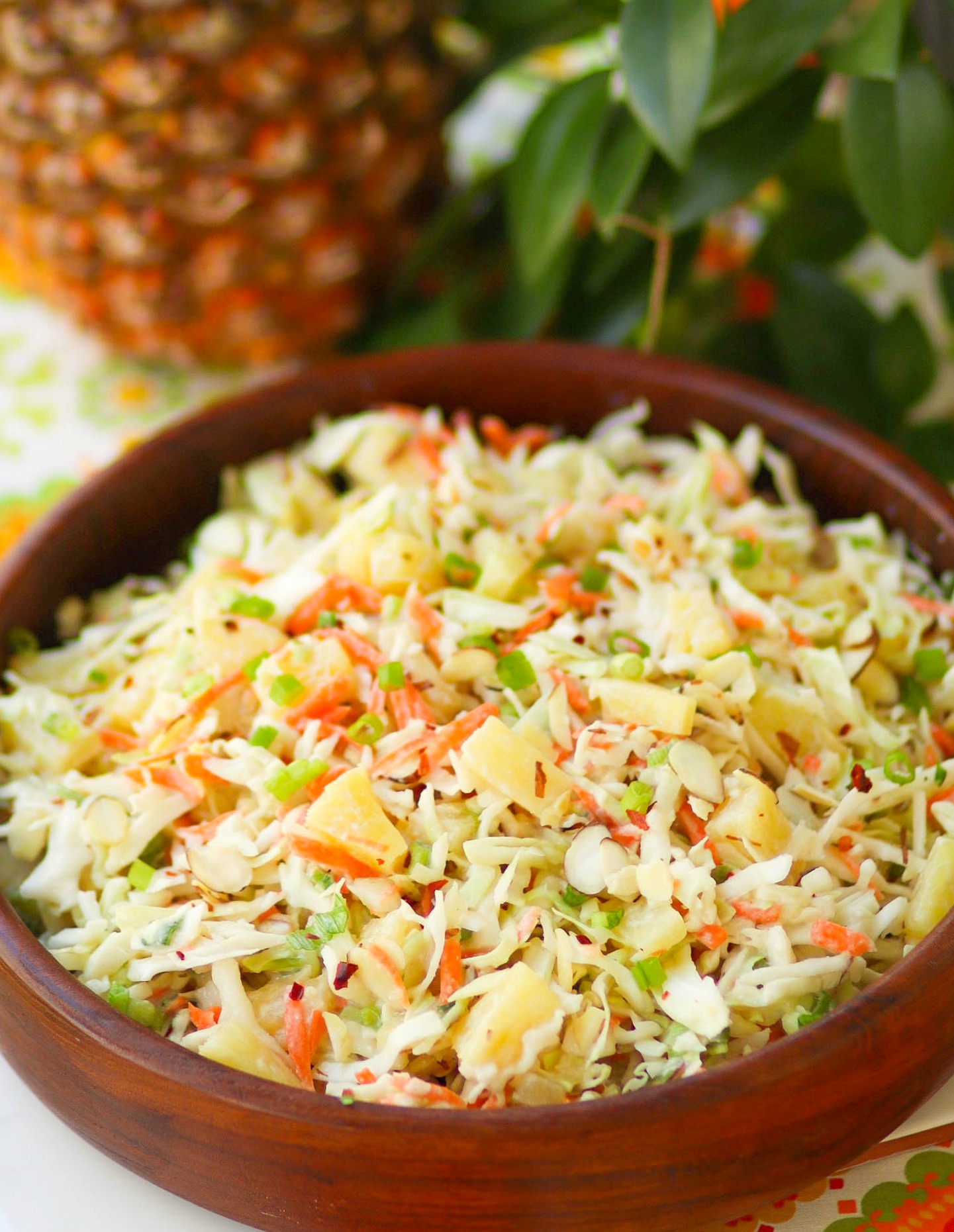 Pineapple Slaw is made with pineapple chunks, bagged cabbage, sliced almonds and green onions with a light, sweet dressing is a side dish that is great for any occasion!