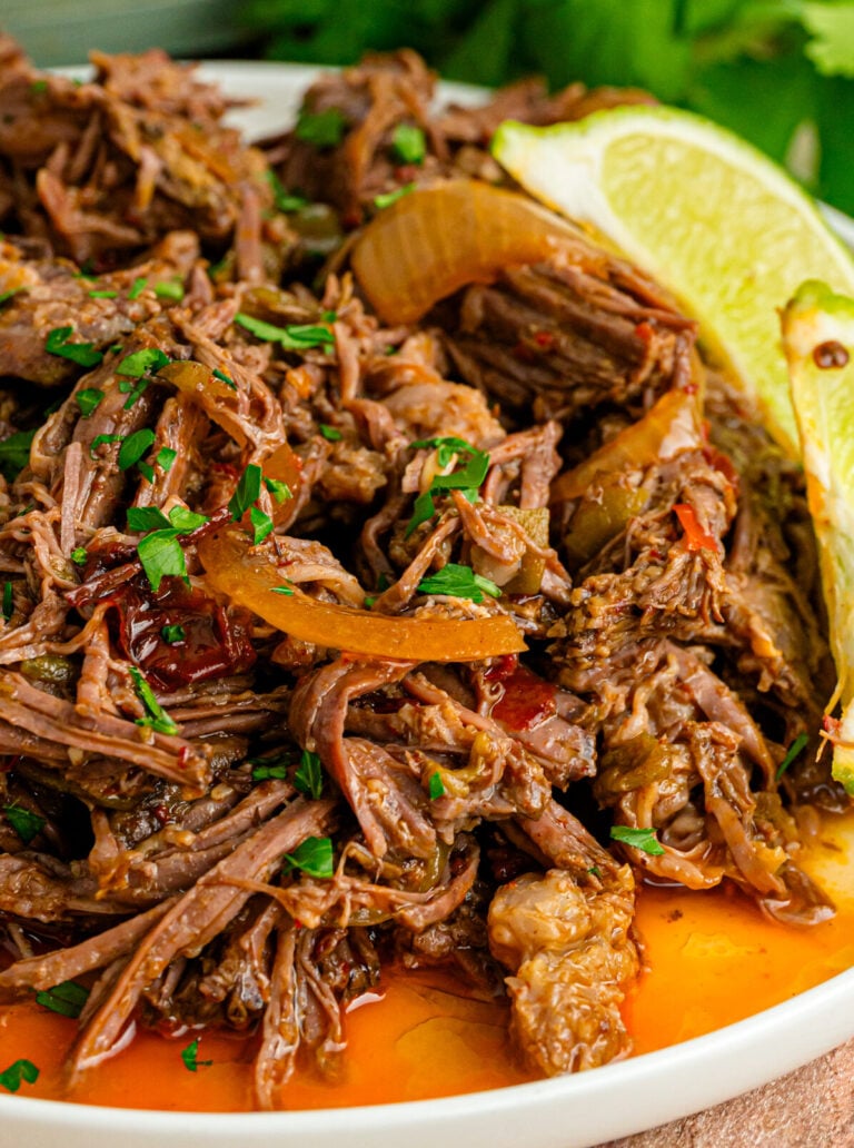 Crock Pot Shredded Mexican Beef served with limes is easy to make and great for so many dishes!