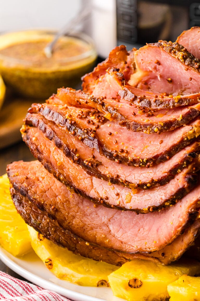 4-Ingredient crock pot ham sliced and ready for a weeknight meal or holiday celebration.